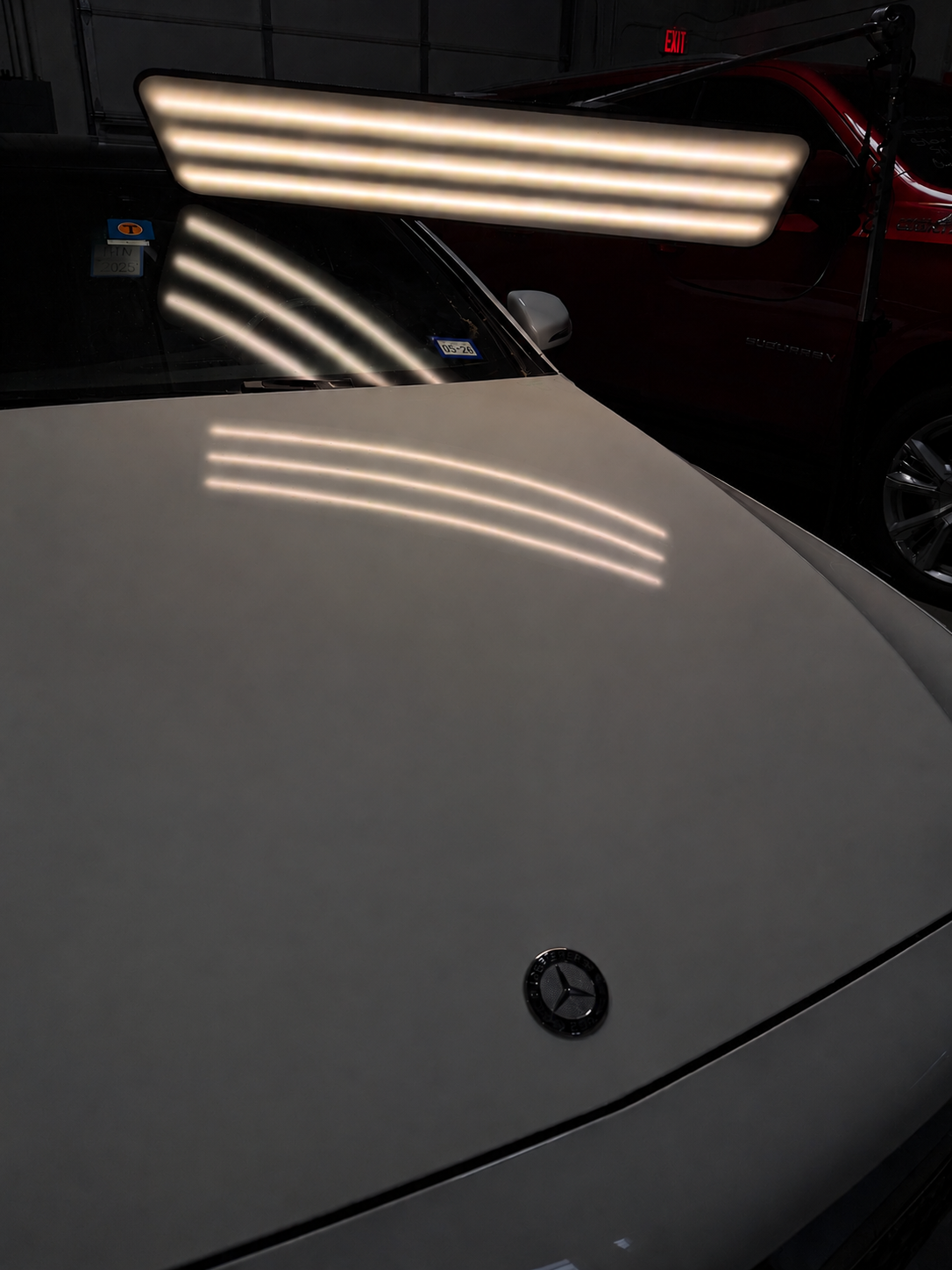 Mercedes-Benz — hood hail damage smoothed back to a flawless factory finish. — After