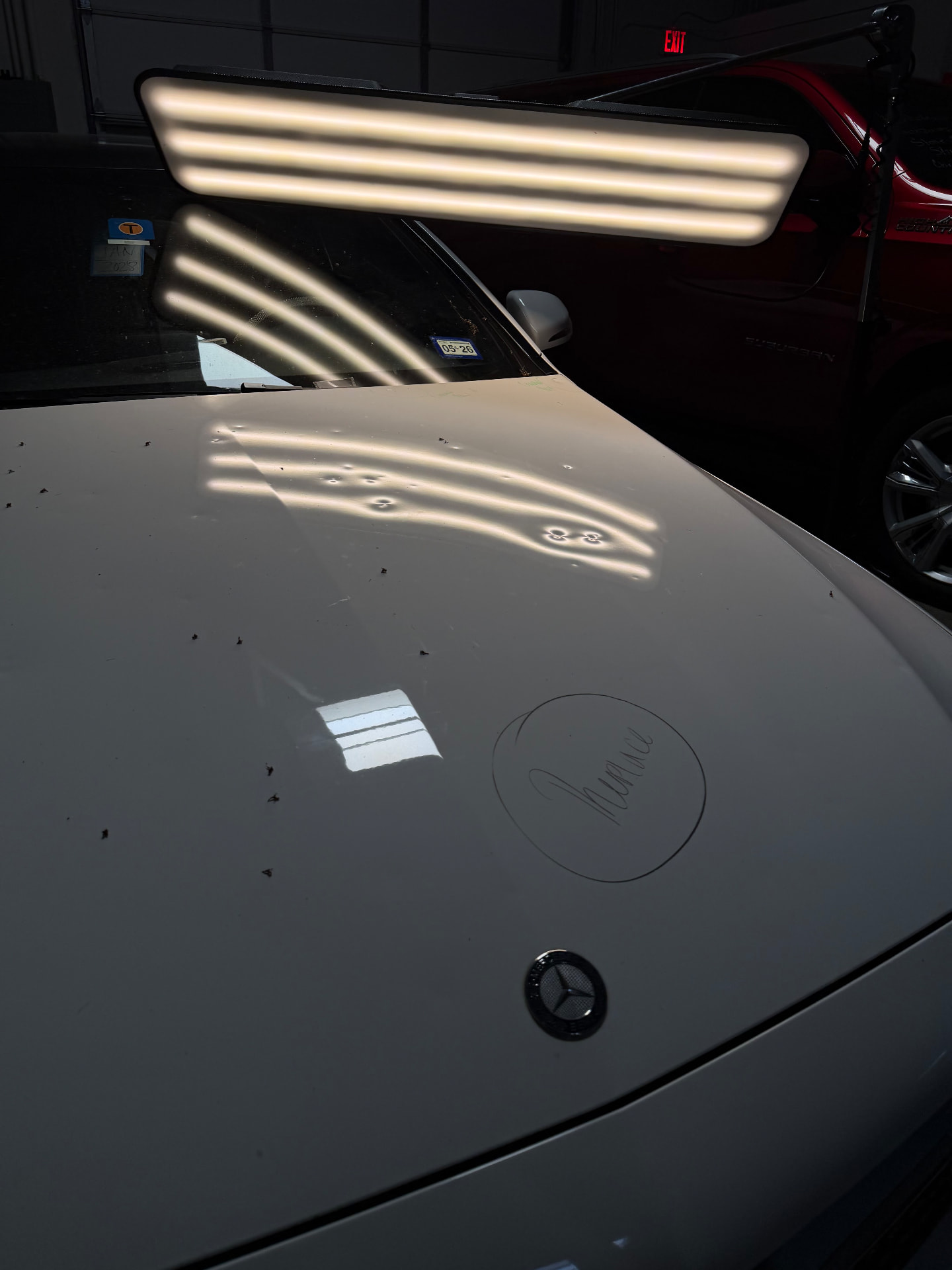 Mercedes-Benz — hood hail damage smoothed back to a flawless factory finish. — Before